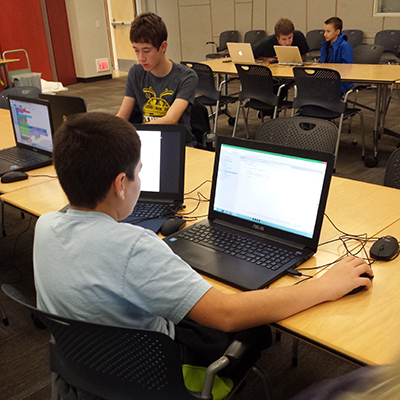Students ages 7-18 learn the basic of coding with help from undergraduate mentors.