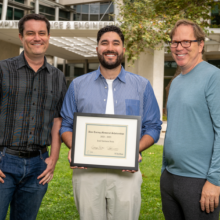 The 2022 Alan Turing Memorial Scholarships recipient José Santana Sosa (center) with CNS Co-Directors George Porter (left) and Stefan Savage (right).