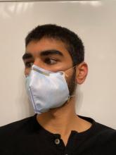 Shiv Patel models one of the DIY masks being developed by the Human-Centered and Ubiquitous Computing Lab and others.