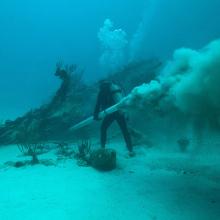 Diver removes sand from bow of Mary Celestia during a 2011 expedition.