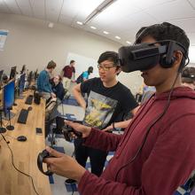 Students demonstrate project application created in professor Schulze&#039;s VR course in spring quarter.