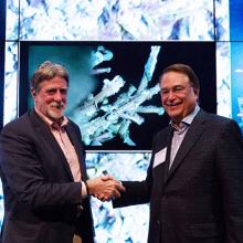 UW&#039;s John Delaney and CSE&#039;s Larry Smarr celebrate delivery of remote-controlled HD video live feed.